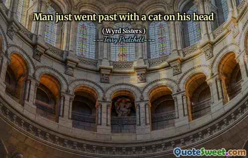 Man just went past with a cat on his head